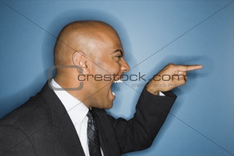 Businessman yelling and pointing.