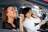 Laughing women in car.