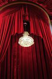 Chandelier with red curtains