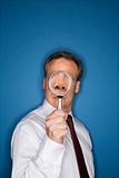 Businessman with magnifier