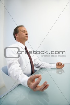 Businessman meditating