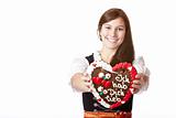 Bavarian woman in love holds Oktoberfest heart.