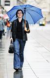 woman on street with umbrella