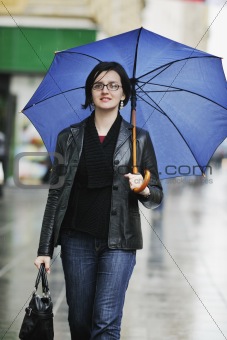woman on street with umbrella