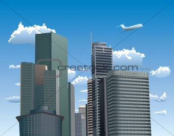 Skyscrapers against blue sky with white clouds