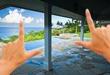 Hands Framing Breathtaking Hawaiian Ocean View Deck and Pool with Deep Blue Sky