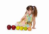 Little girl on white background with apples