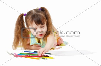 Child draws with color pencils on white