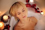 nude woman in foamy bath