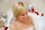 nude woman in foamy bath 