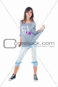 Young smiling brunette in jeans. 