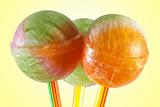  three multicolor lollipop candy