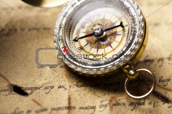 Compass on the old paper background