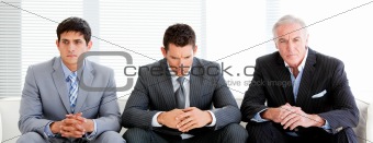 Three charismatic businessmen in a waiting room