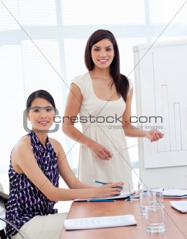 Portrait of two businesswomen at a presentation