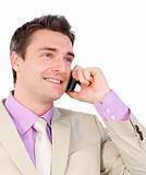 Smiling young businessman on phone 