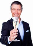 Successful businessman toasting with Champagne 