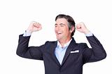 Attractive businessman punching the air celebrating a victory