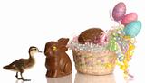 easter basket filled with eggs and chocolate bunny with baby duck