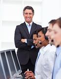 Self-assured businessman presenting a call center