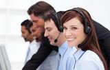 Pretty businesswoman and her team working in a call center