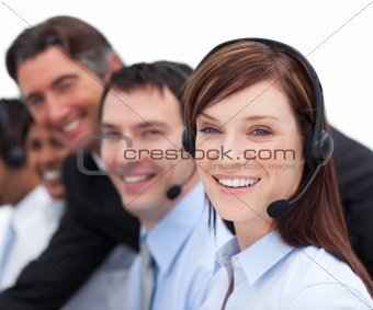 Portrait of a businesswoman and her team working in a call cente