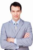 Confident businessman with folded arms