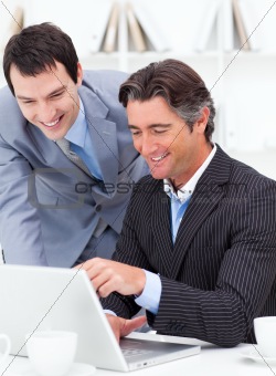 Two assertive colleagues working at a computer