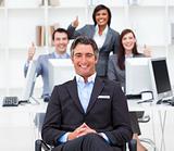 Cheerful businesspeople with thumbs up