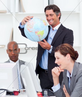 Portrait of a lucky business team talking about globalization