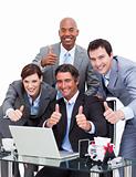 Enthusiastic business team with thumbs up