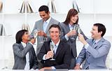 Cheerful business people toasting with Champagne