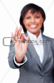 Success businesswoman showing OK sign