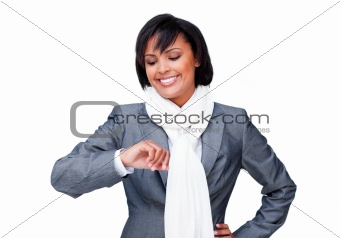 Young businesswoman looking at her watch