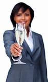 Hispanic businesswoman toasting with Champagne
