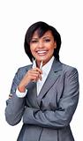 Smiling businesswoman holding a pen