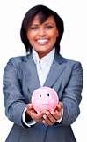Hispanic Businesswoman holding a piggybank