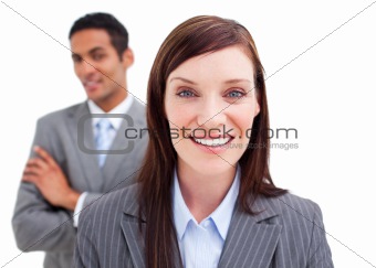 Portrait of businesswoman posing in front of her colleague