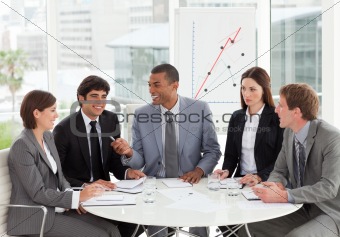 Smiling business people discussing a budget plan