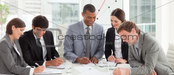 A diverse business group studying a budget plan