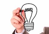Businessman hand drawing black light bulb isolated on white