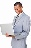 Young businessman using a laptop 