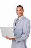 Smiling Confident businessman using a laptop 