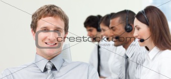 Young manager with his team in a call center