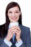 Smiling businesswoman drinking a tea