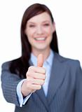 Portrait of an attractive businesswoman with thumb up