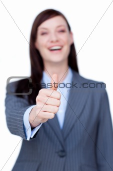 Laughing businesswoman with thumb up