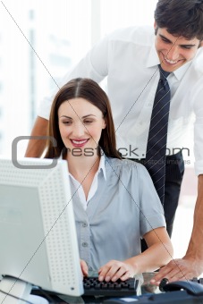Smiling Businessman helping his colleague
