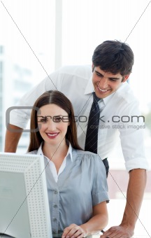 Attractive Co-workers at a computer 