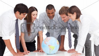 A meeting of business team around a terrestrial globe
